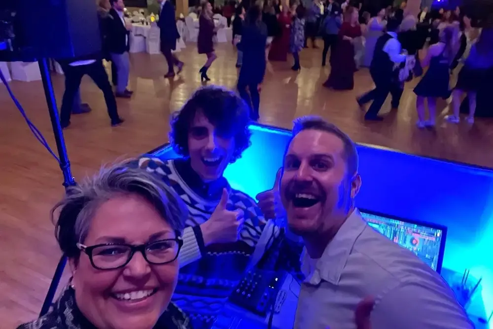 3 people in selfie in the DJ booth